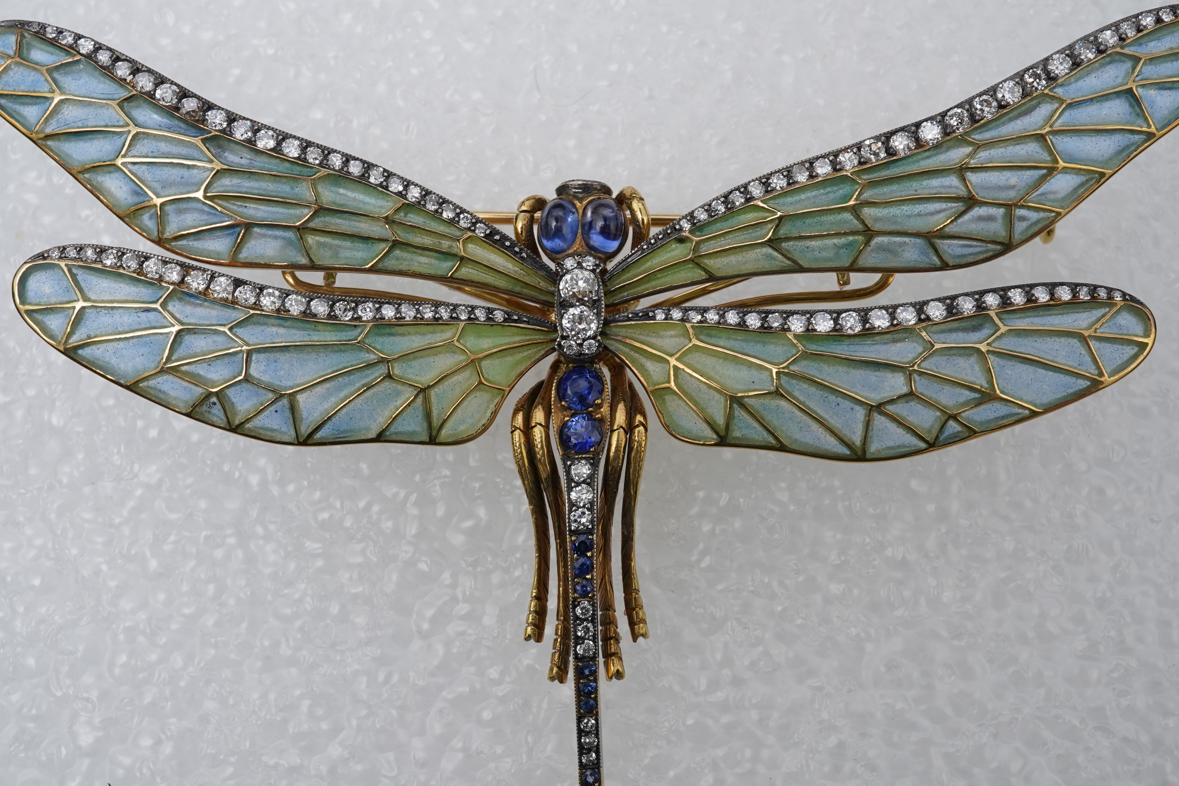 An enamel, sapphire and diamond dragonfly brooch
